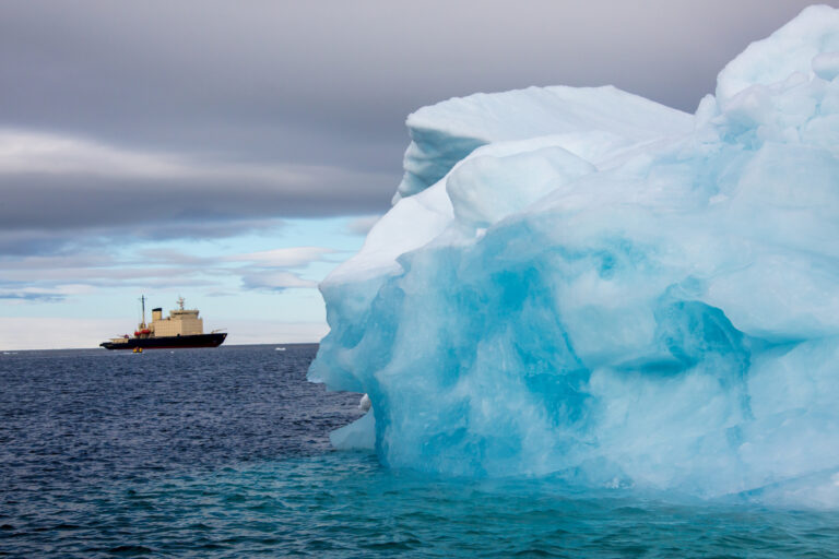 Iceberg with reflection drifting in the arctic ozean