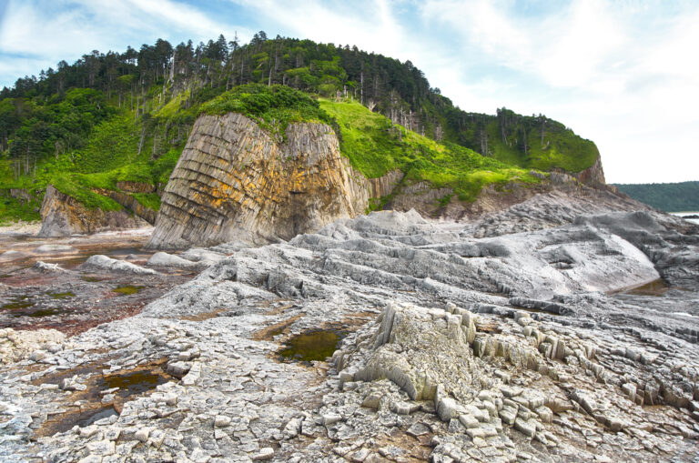 Rocky coast, volcanic rock formation, Kunashir island, cape Stolbchaty