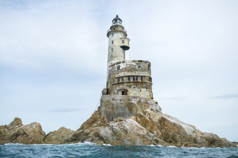 Abandoned Japanese lighthouse on the rock in the south of Sakhalin Island, Russia